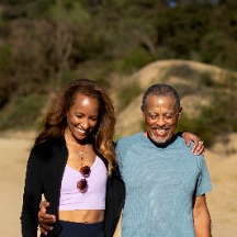 two mature couples walking together